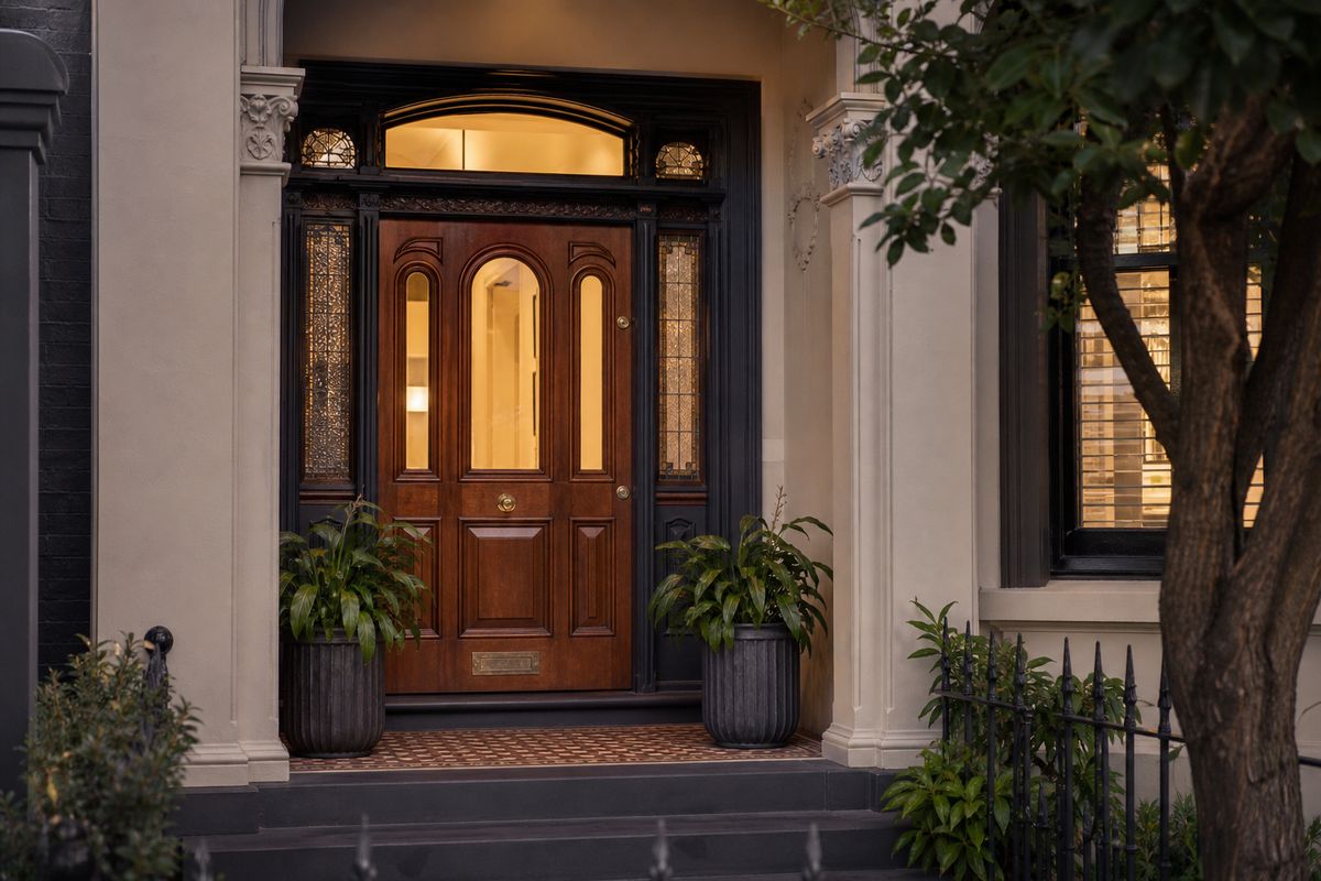 Elegant timber front door on a Melbourne home with warm wood grain and heritage character