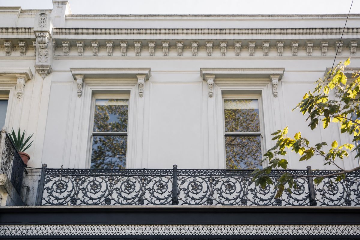 Timber double hung sash windows on a Melbourne Victorian terrace facade